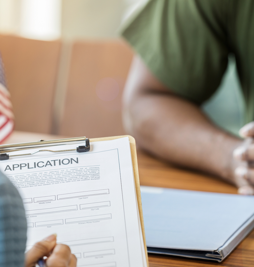Two people meeting with documents