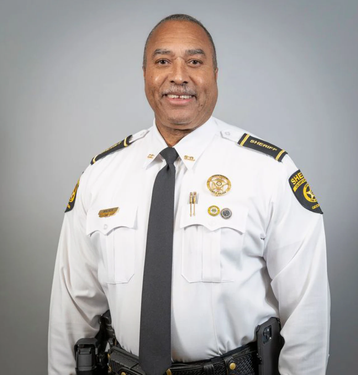 Police officer with badges and tie